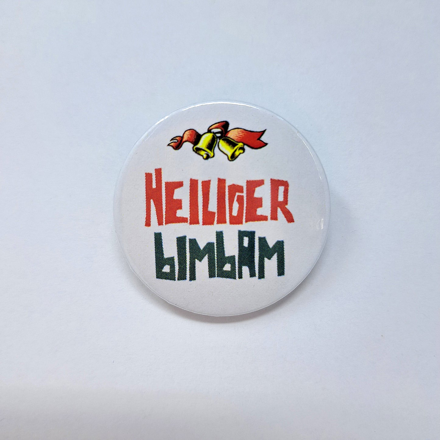 Button "Heiliger Bimbam"