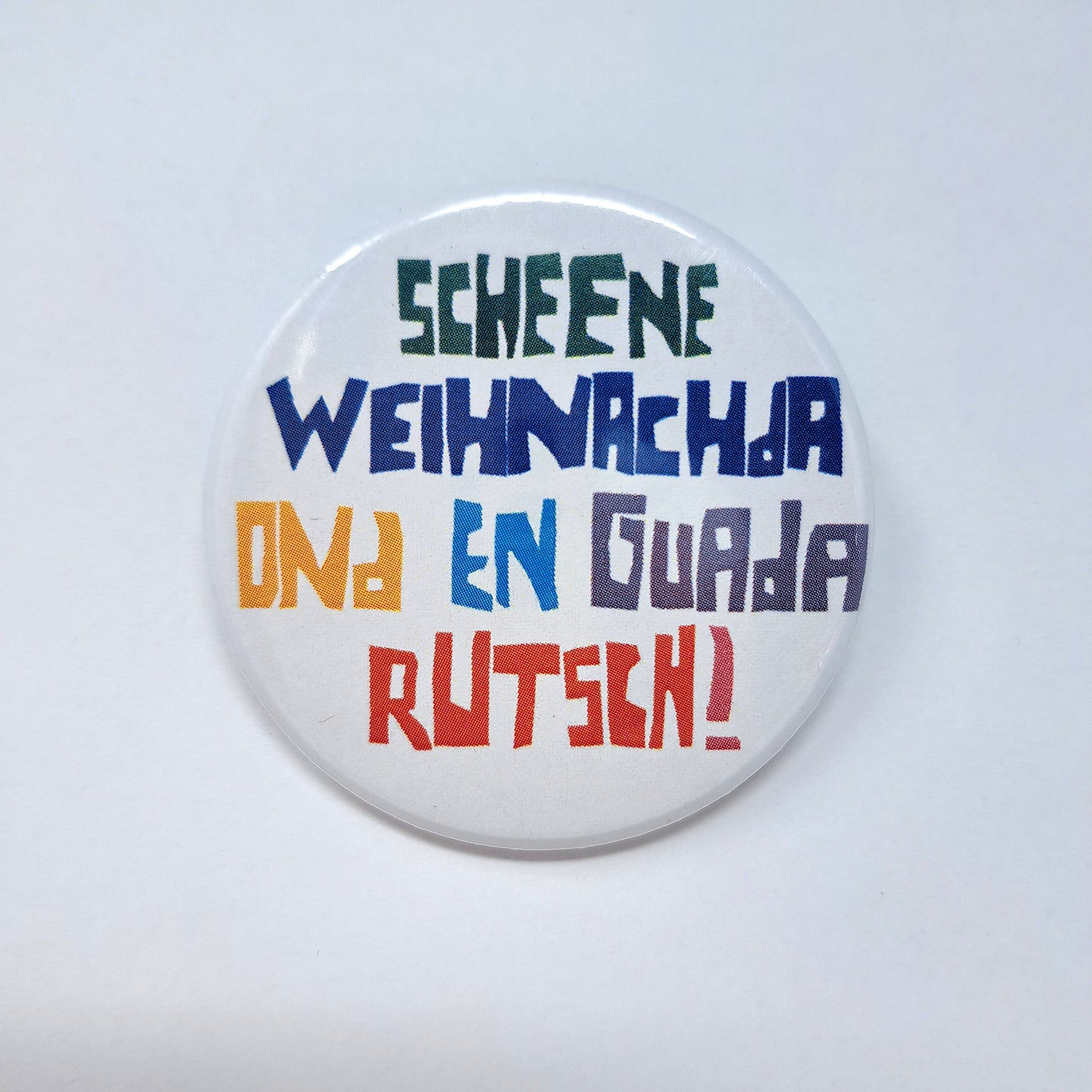 Button "Scheene Weihnachda"